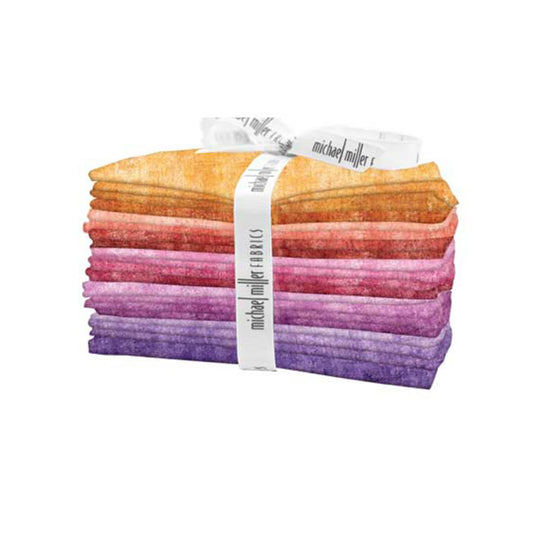 Stack of colorful fabric strips with a white band labeled 'Michael Miller Fabrics' on a white background.