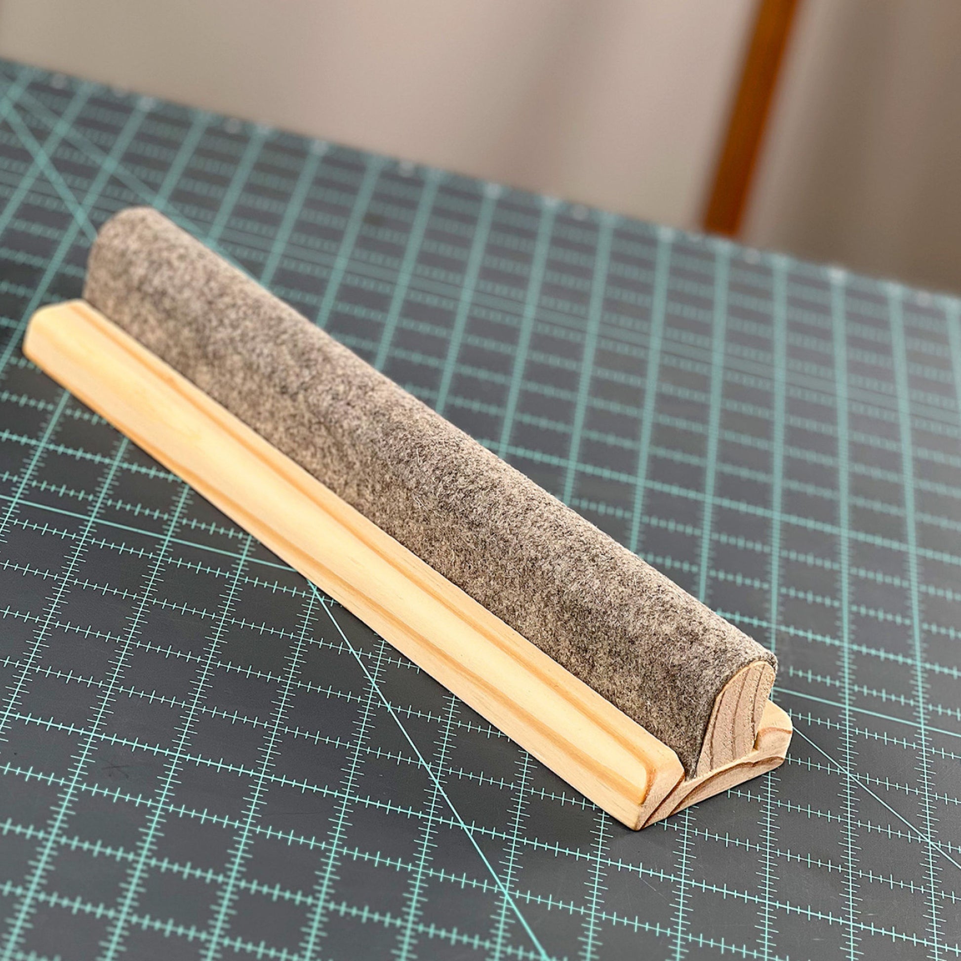 Wool Pressing Bar by Gypsy Quilter on cutting mat