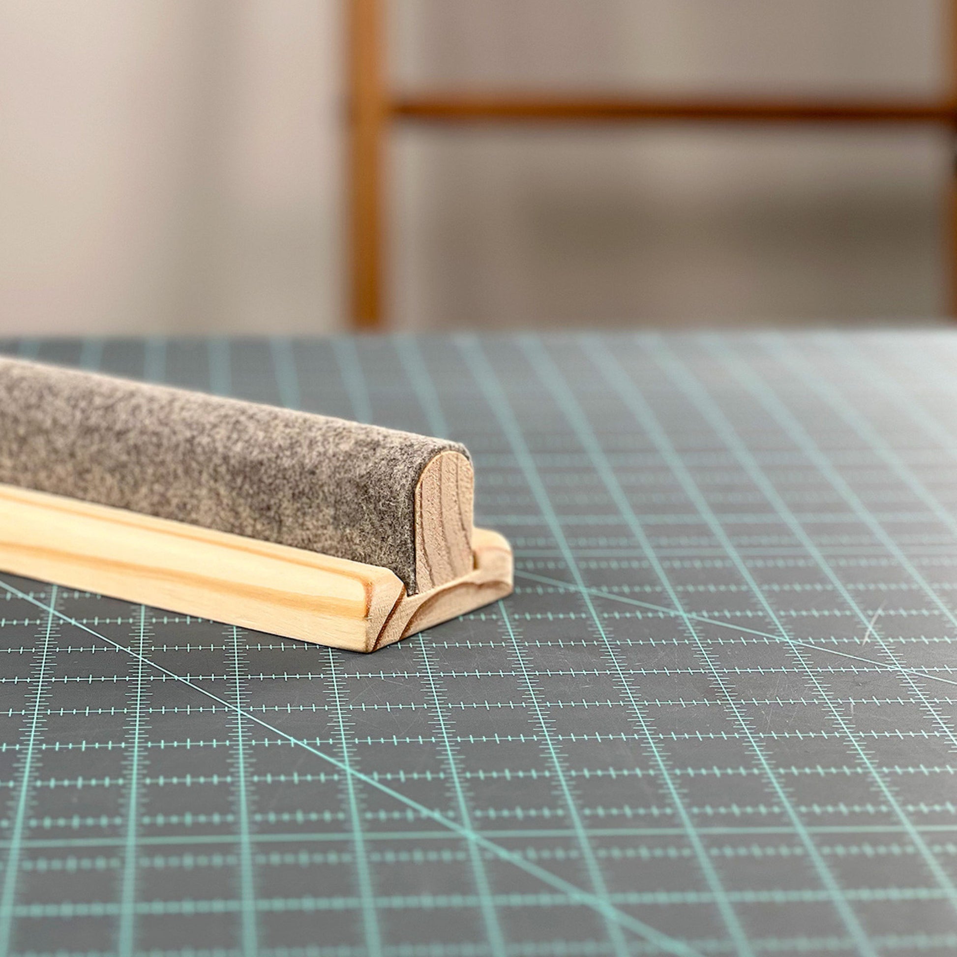 Wool Pressing Bar by Gypsy Quilter side profile on cutting mat