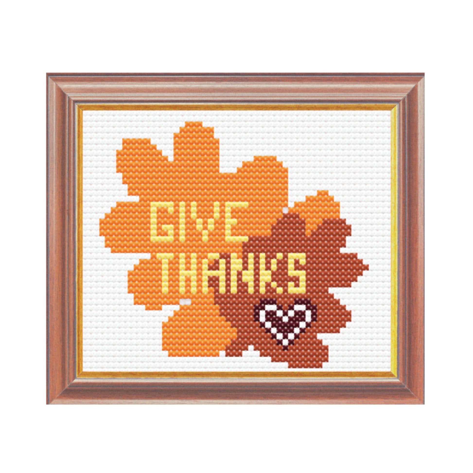 Cross-stitched design with 'Give Thanks' text in a wooden frame