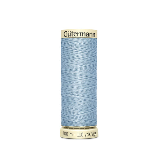 Spool of Gutermann thread on a white background