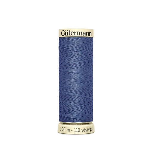 Spool of Gutermann thread on a white background