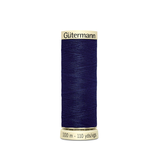 Spool of Gutermann thread on a white background