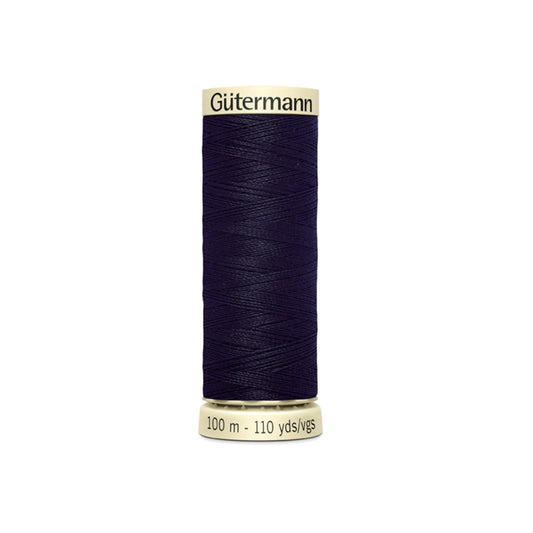 Spool of Gutermann thread on a white background