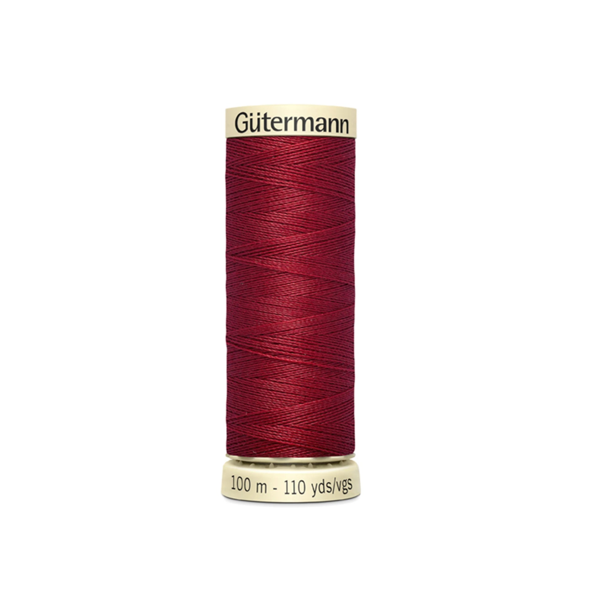 Spool of Gutermann thread on a white background