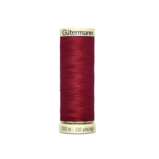Spool of Gutermann thread on a white background