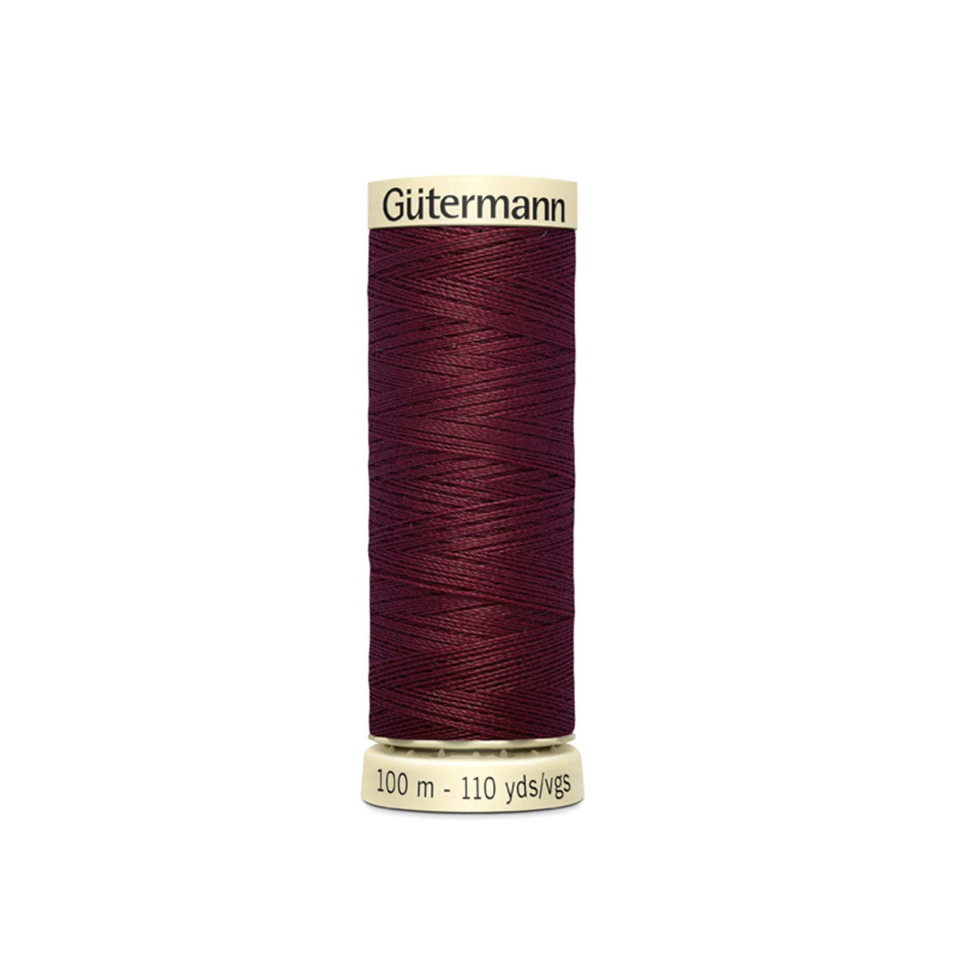Spool of Gutermann thread on a white background