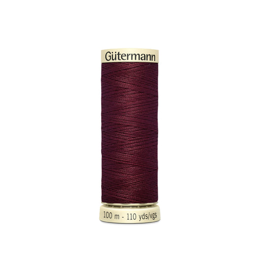 Spool of Gutermann thread on a white background