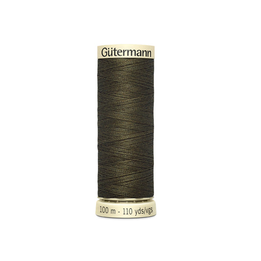 Spool of Gutermann thread on a white background