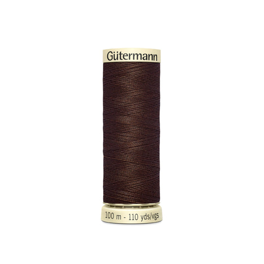 Spool of Gutermann thread on a white background