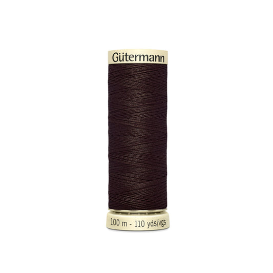 Spool of Gutermann thread on a white background