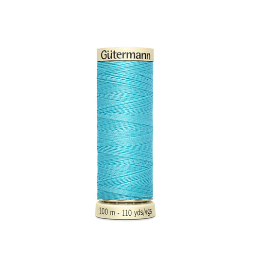 Spool of Gutermann thread on a white background