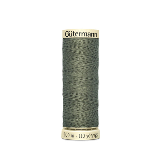Spool of Gutermann thread on a white background