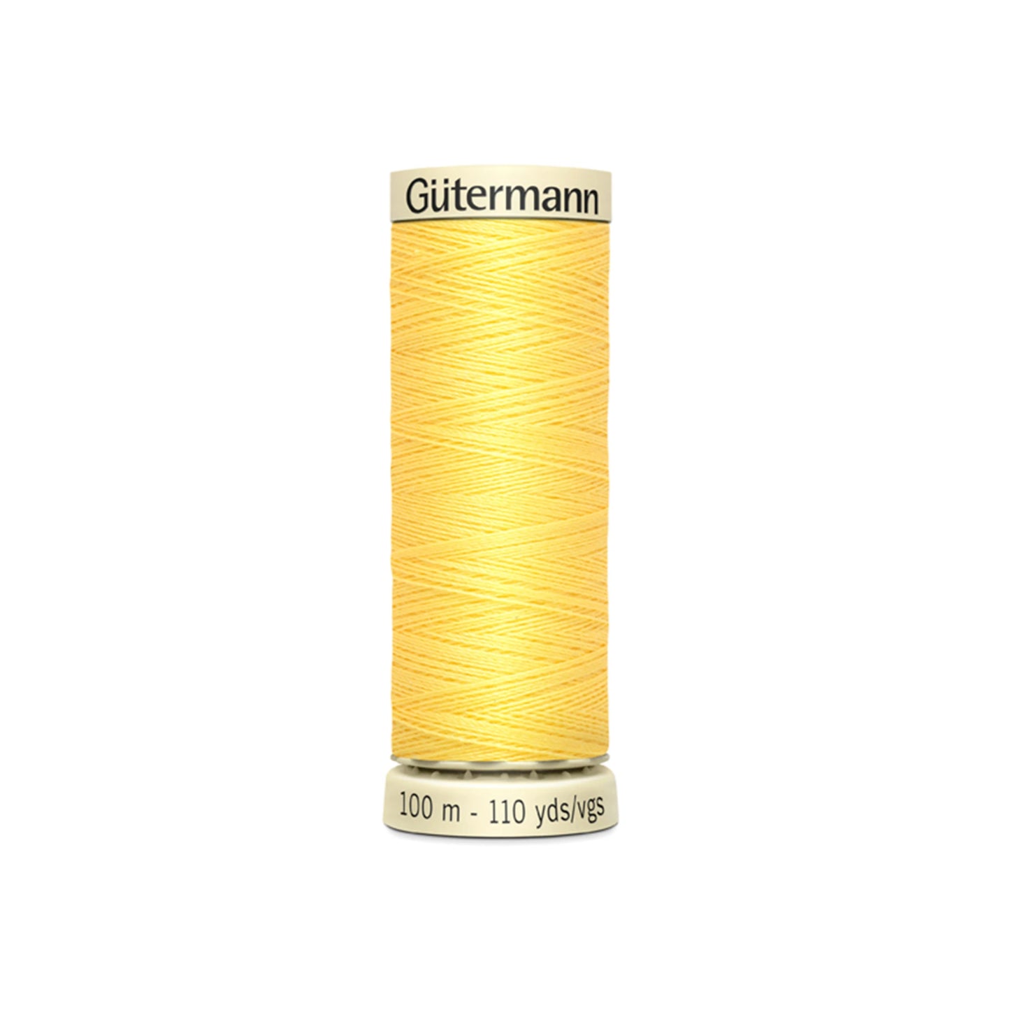 Spool of yellow Gutermann thread on a white background