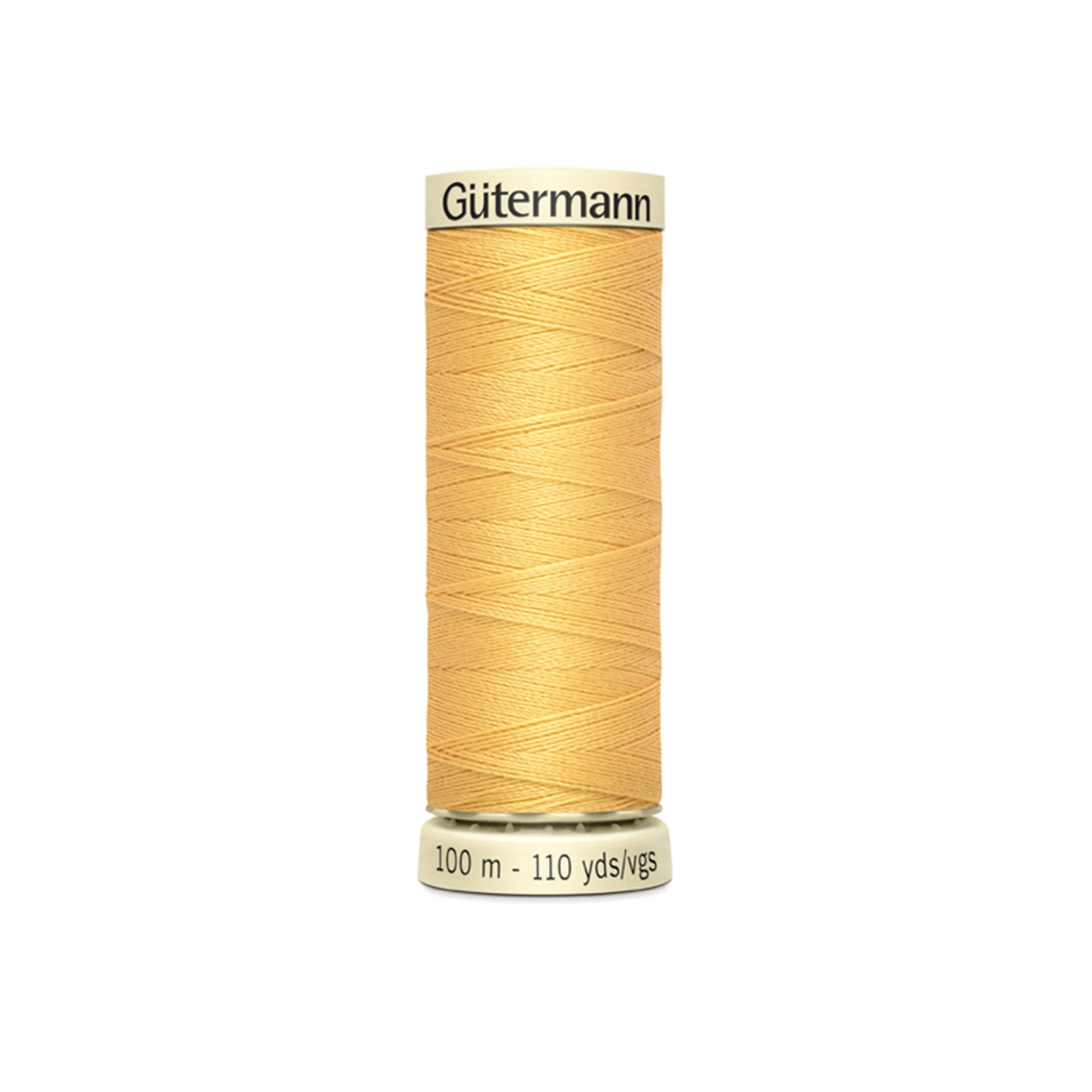 Spool of Gütermann thread on a white background