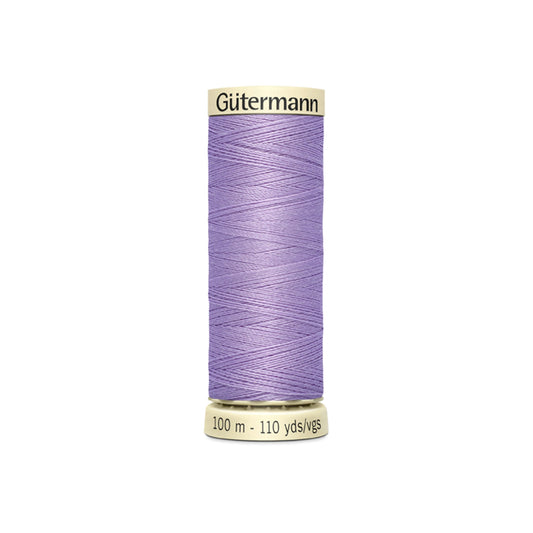 Spool of Gutermann thread on a white background