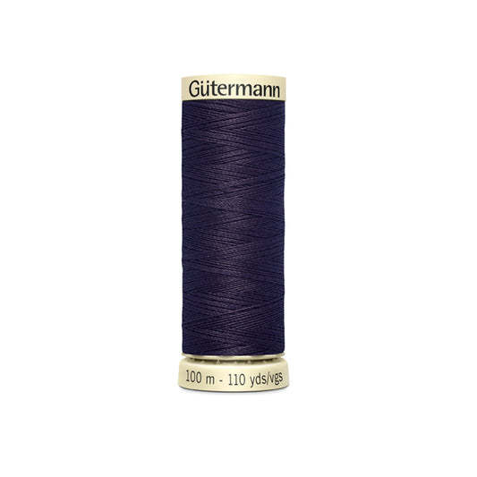 Spool of Gutermann thread on a white background