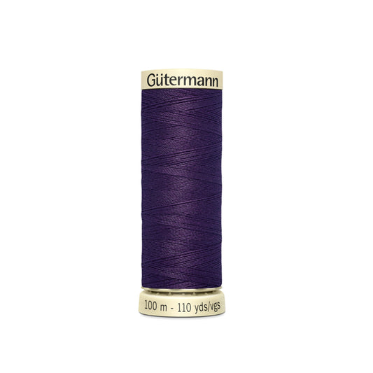 Spool of Gutermann thread on a white background