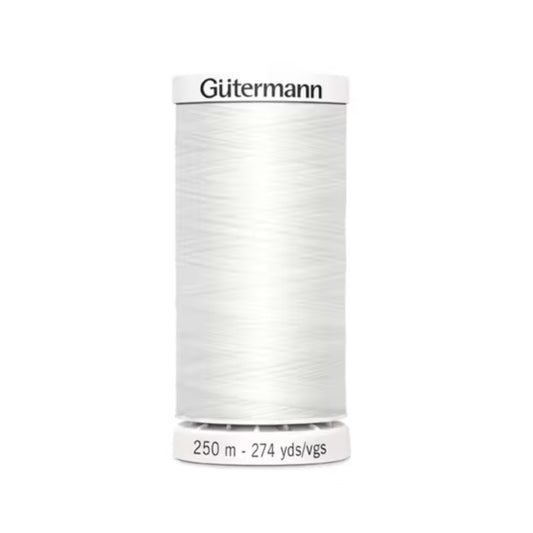 Spool of Gutermann thread on a white background