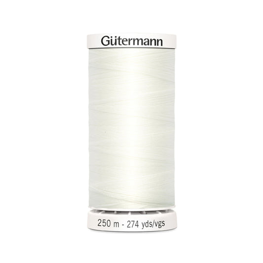 Spool of Gutermann thread on a white background