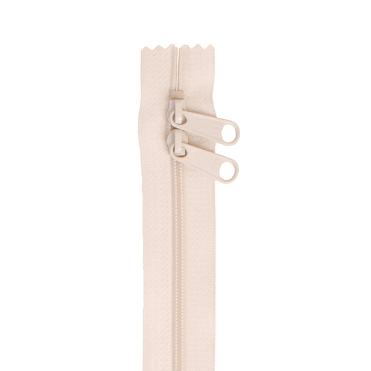 Beige zipper on a white background