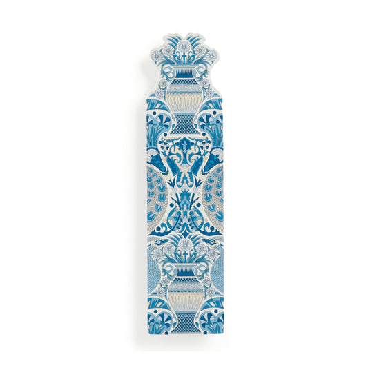 A decorative ceramic wall plaque featuring a symmetrical blue and white floral and scrollwork pattern, shown on a clean white background.