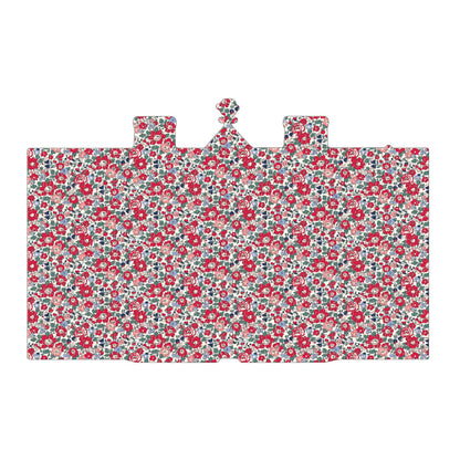 Back of the Liberty Tudor puzzle with a dense, small-scale floral pattern in red, pink, blue, and white, on a plain white background.