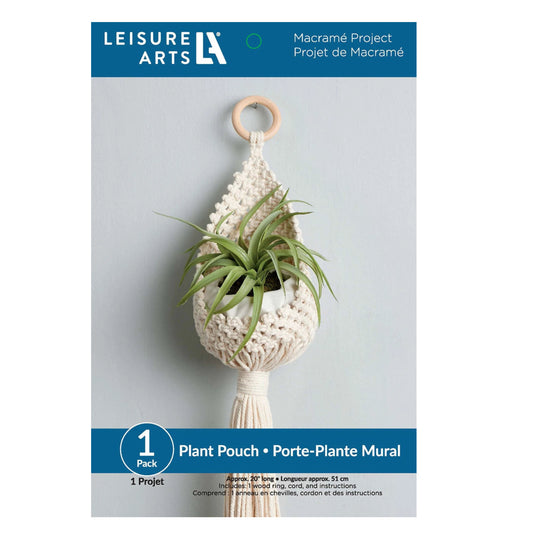 Leisure Arts macramé plant pouch kit packaging with a plant on a gray background