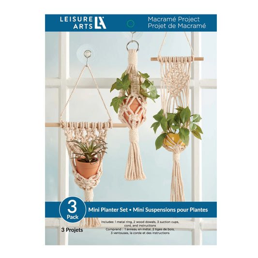 Leisure Arts macramé mini planter set packaging with plants and hooks.