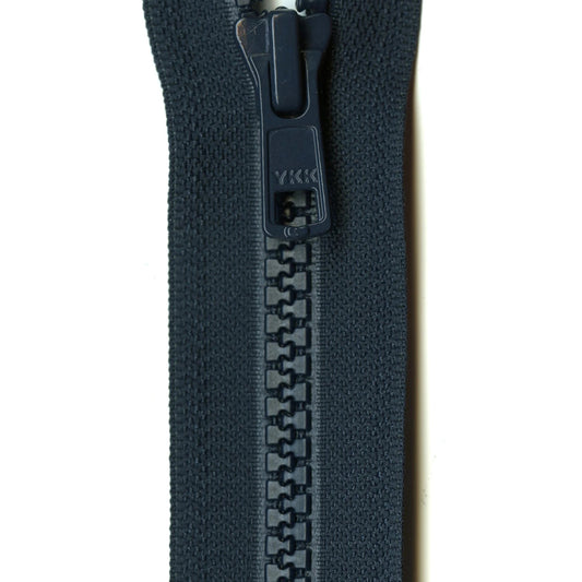 Close-up of a navy zipper on a white background