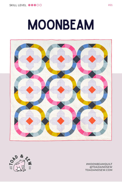 Quilt pattern cover titled 'Moonbeam' with colorful geometric design on a light pink background.
