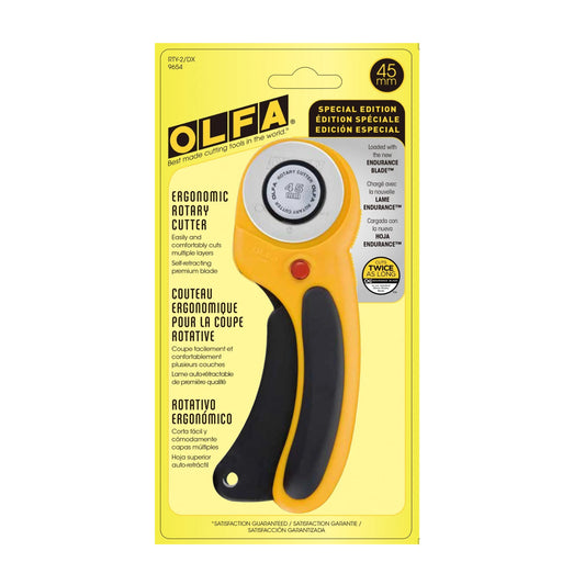 OLFA ergonomic rotary cutter on a yellow packaging background