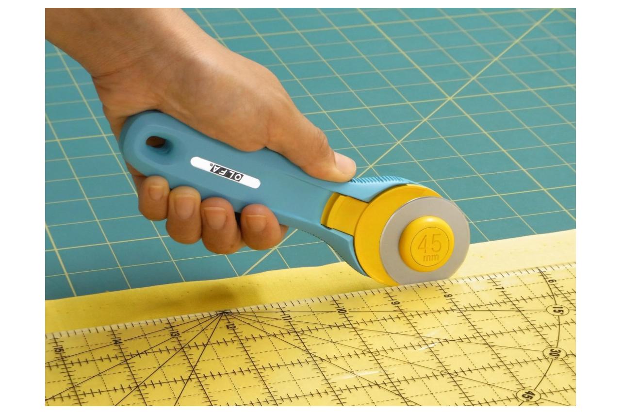 Olfa Splash 45mm Rotary Cutter in left hand use