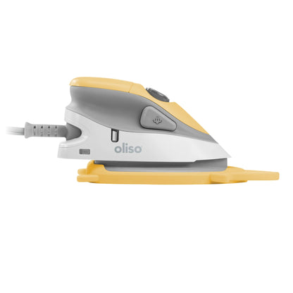 White and yellow iron with 'oliso' branding on a white background