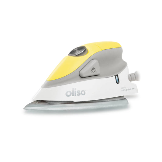 White and yellow Oliso iron on a white background