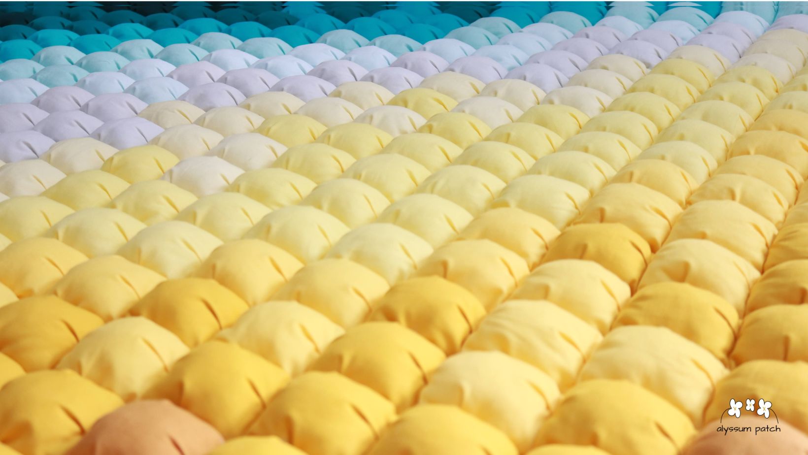 A close-up view of the Seaside Puff Blanket 