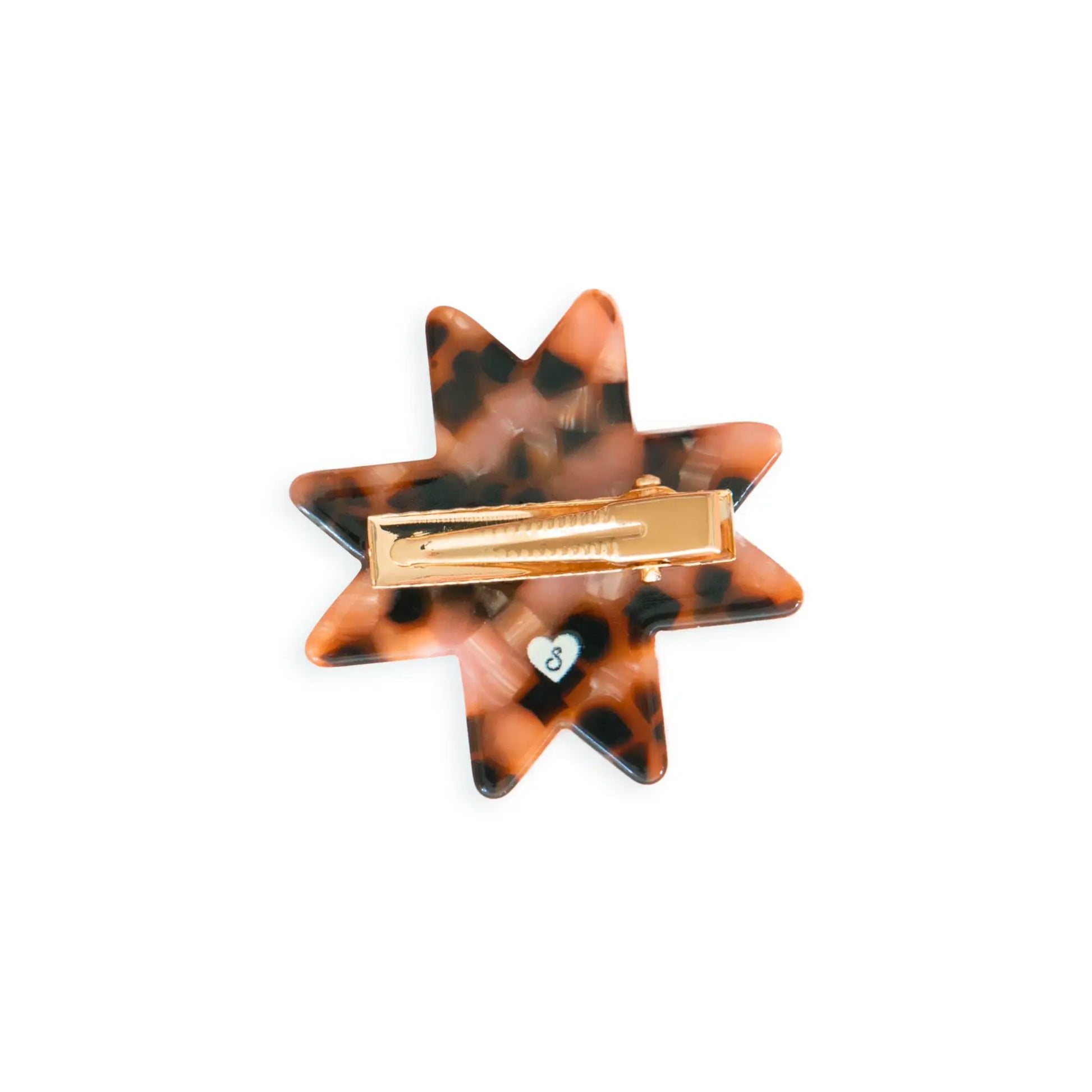 Star-shaped hair clip with tortoiseshell pattern and gold barrette on a white background