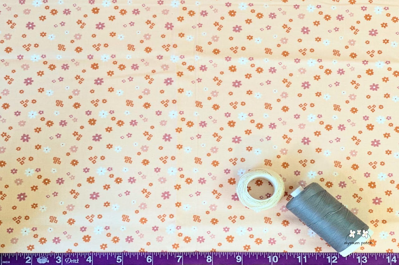 Close Up of Serene Florals Fabric showing size of print
