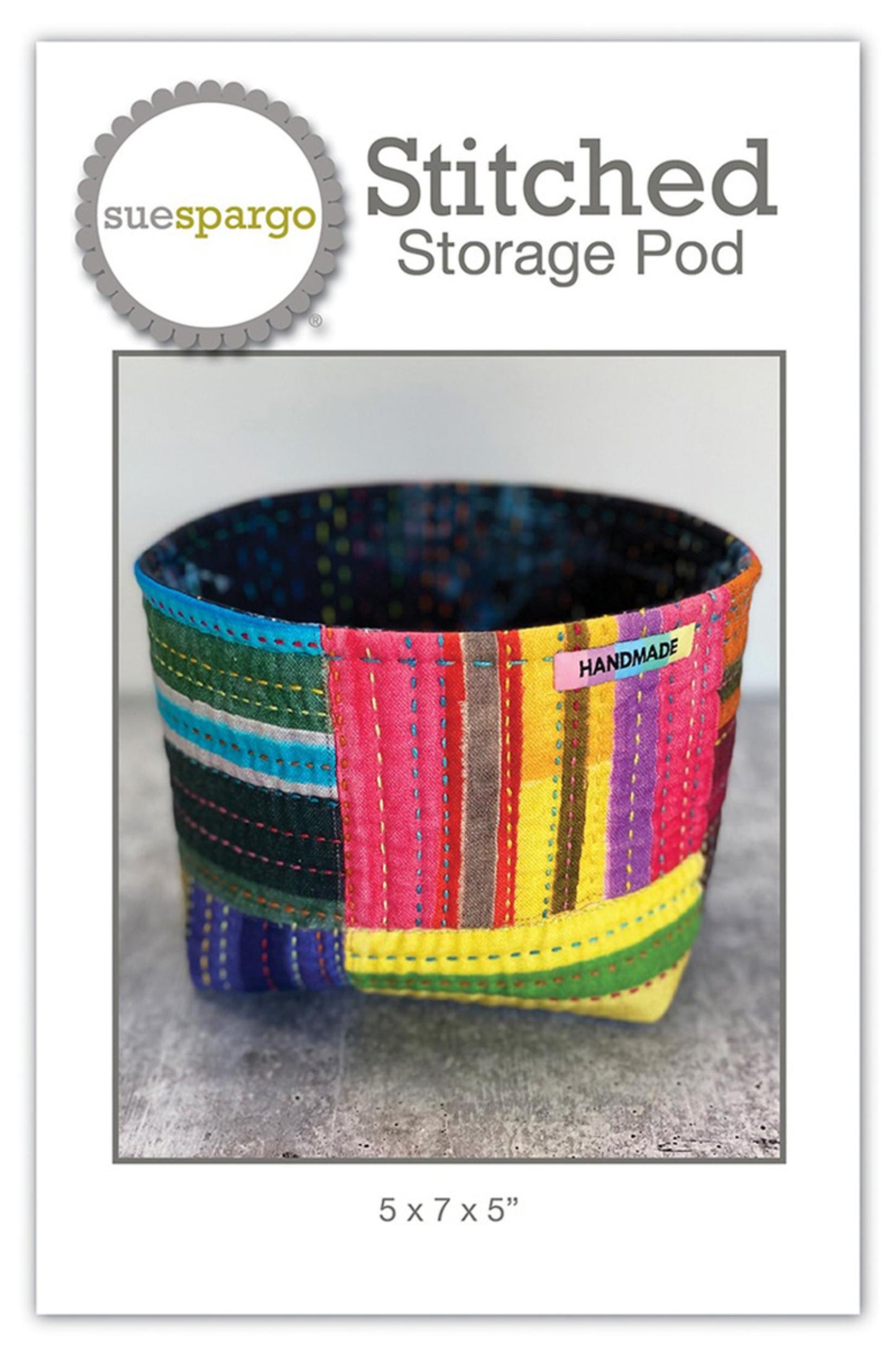 Colorful striped storage pod with 'sue spargo' branding on a white background