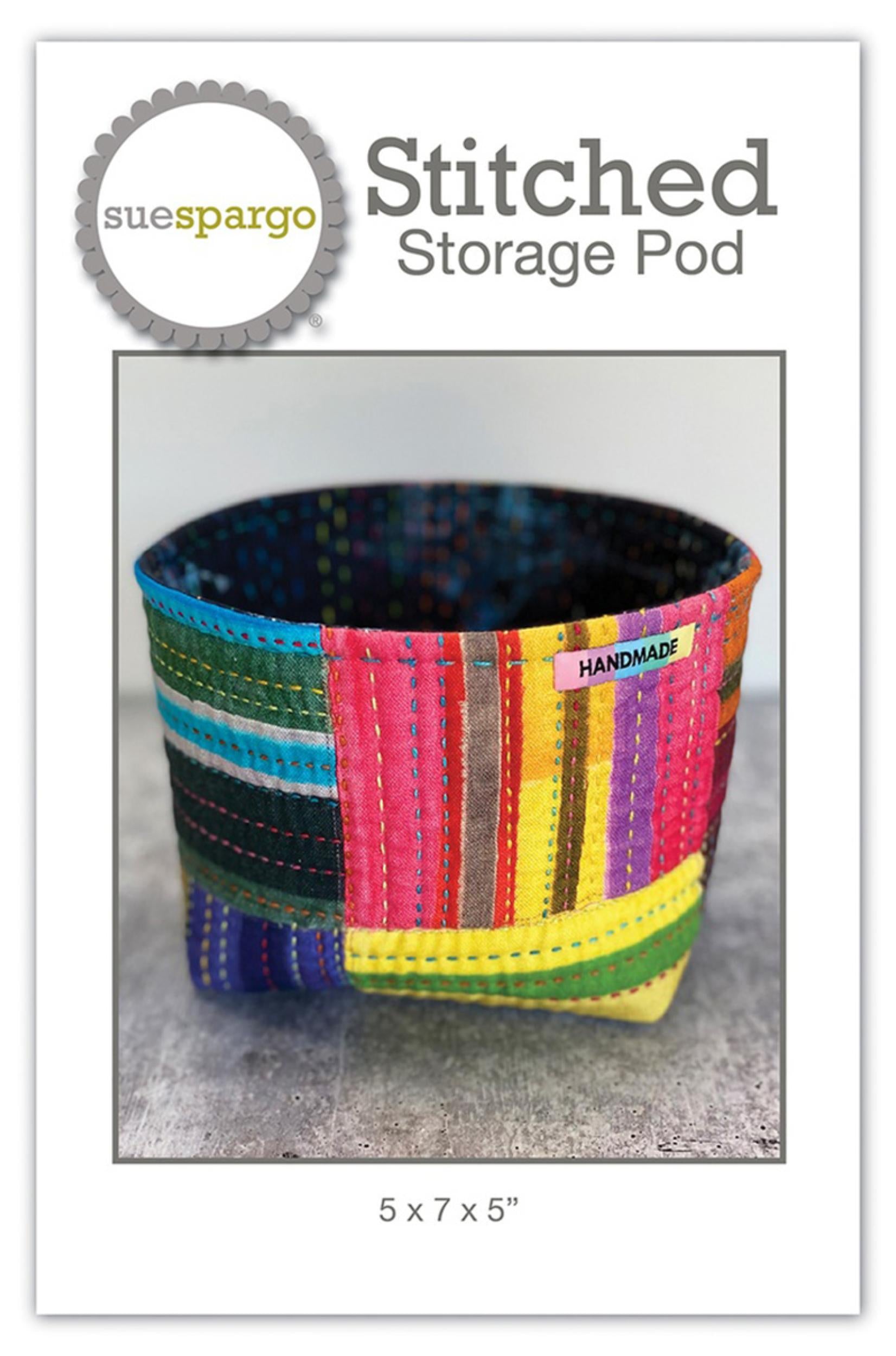 Colorful striped storage pod with 'sue spargo' branding on a white background