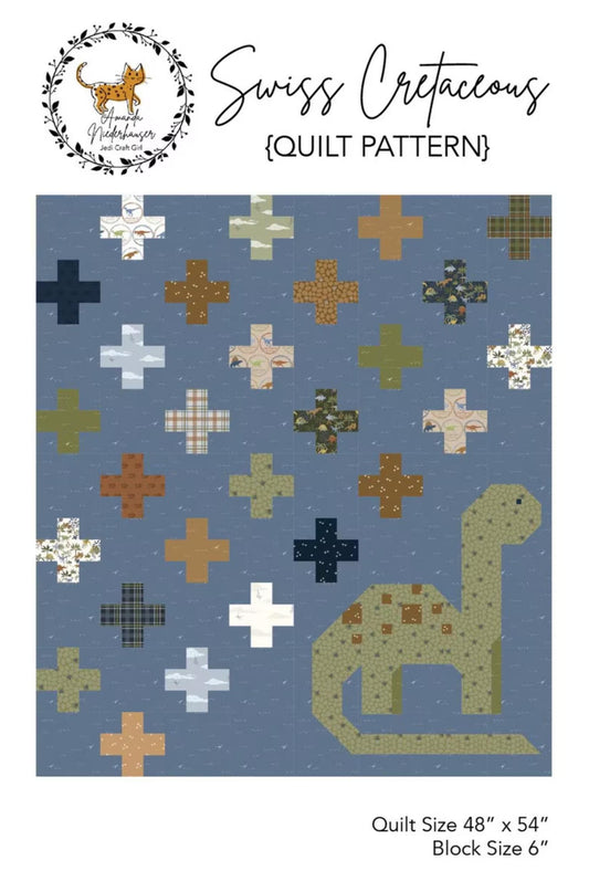 Swiss Cretaceous quilt pattern cover showing a blue quilt design with scattered cross motifs in different colors and a dinosaur silhouette in the lower right. The top includes the title 'Swiss Cretaceous {Quilt Pattern}' and a circular logo, with size information at the bottom.