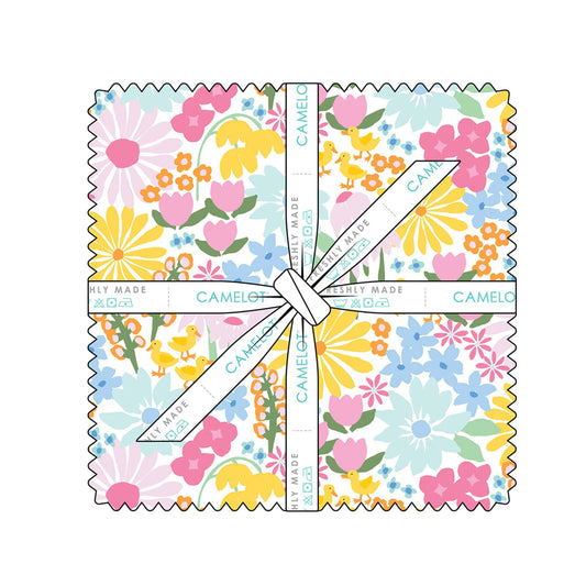 A square fabric sample with scalloped edges, featuring a colorful floral print in pink, yellow, blue, and orange. The fabric is wrapped with a white ribbon printed with the brand name 'CAMELOT' text, set against a plain white background.
