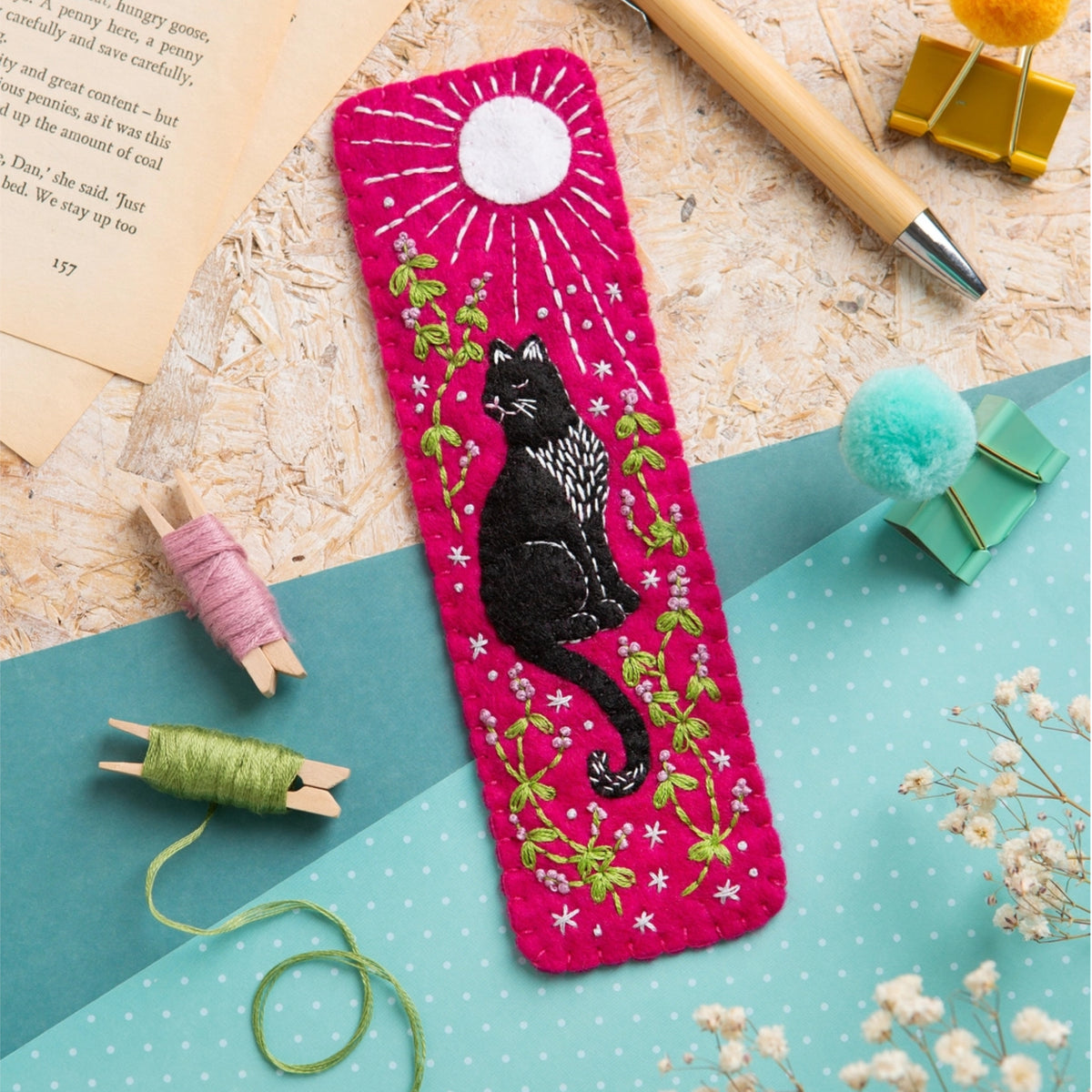 Black Cat Embroidered on a pink background with a moon in the sky