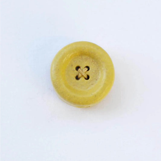 Yellow button on a white background