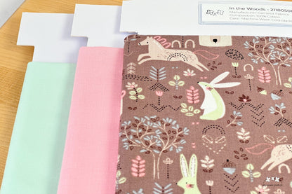 In the Woods half yard precut paired with Kona Cotton Solids Sea Mist and Baby Pink