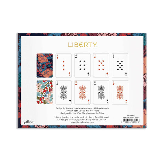 A square product card for a Liberty playing card deck, featuring a white center with eight illustrated playing cards and decorative floral border artwork. Visible text includes the brand name LIBERTY and maker name gallison.