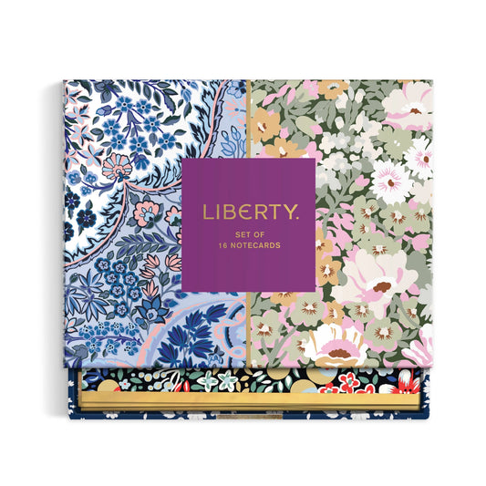 A boxed set of floral-patterned notecards labeled 'LIBERTY. SET OF 16 NOTECARDS' in gold text on a purple front cover, shown on a clean white background.