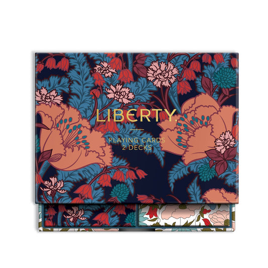 Liberty Playing Cards 2 Decks box featuring a dark navy blue background with a vibrant floral pattern in coral, red, teal, and pink, with gold lettering.