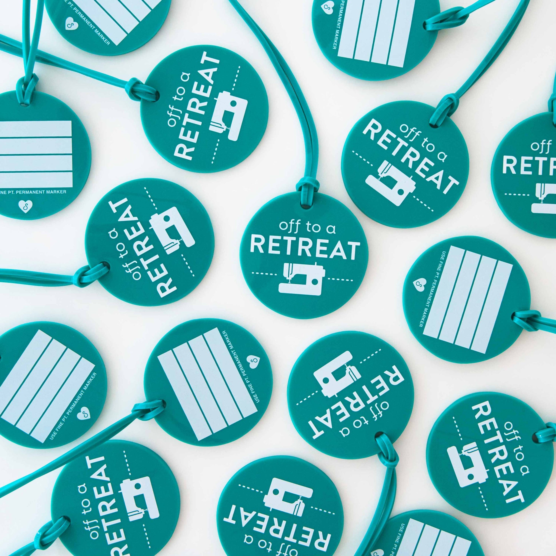 Multiple teal tags with 'off to a retreat' text and graphics on a white background