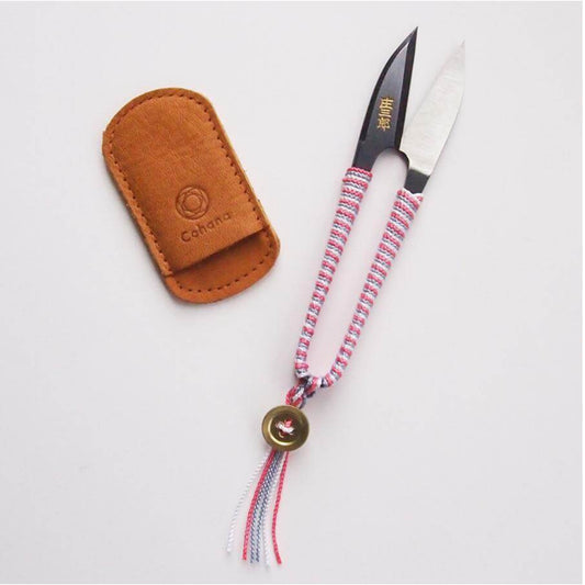 Pink Braided Snips and brown sheath on a white background